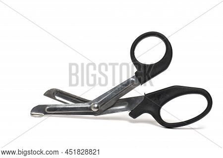Close Up Of Slightly Opened Blunt Metal Bandage Scissors With Black Handles For Safe Cutting Of Woun