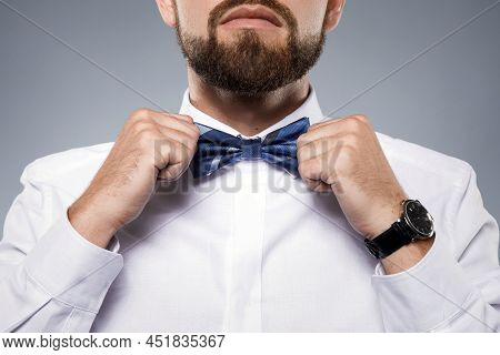 Man Is Fiting Up A Beautiful Bow Tie