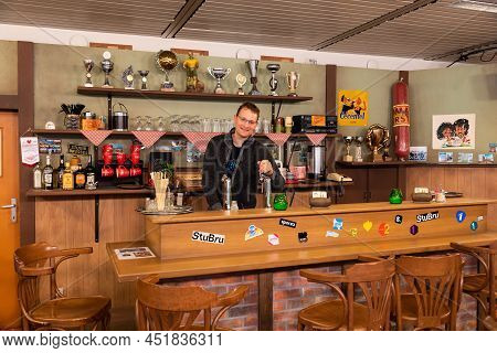 Schaerbeek, Brussels Capital Region, Belgium - 03 26 2022 - The Cafe With A Bar And Wooden Decoratio