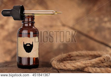 Beard Oil, Barbershop Product Photography. Brown Bottle, Mock-up. Bottle With Extract On Wooden Back