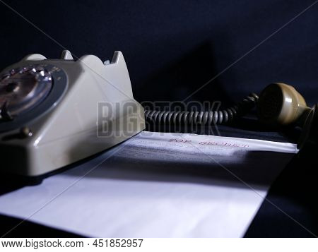 Top Secret Document In Dark Room With Vintage Phone