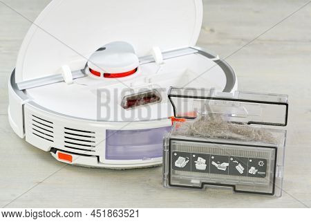Robot Vacuum Cleaner Water Tank Removed And The Filter Lid Is Opened To Clean. Smart Cleaning And Wa