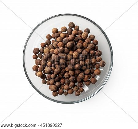 Allspice Jamaica Pepper In A Glass Saucer Cutout. Transparent Plate With Dried Pimento Berries Isola