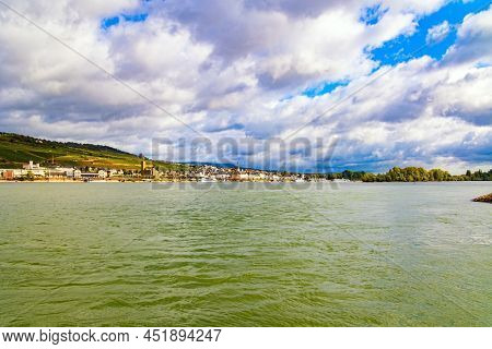 Smooth flow of the great river Rhine. Romantic castles on the banks of the Rhine. The hills are home to the famousl vineyards. 