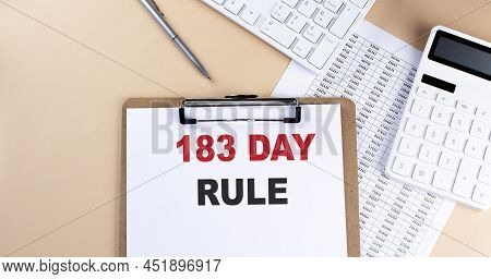 Clipboard With White Blank Paper Text 183 Day Rule , Keyboard Calculator And Chart, Business Concept