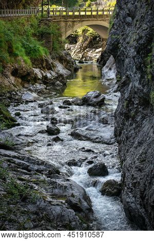 Mountain River In The Gorge Of Mountains Near The City Of San Pelegrino In Italy