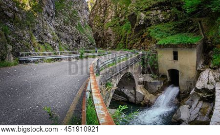 Mountain Road In The Gorge Of The Mountains Near The City In Italy San Pelegrino