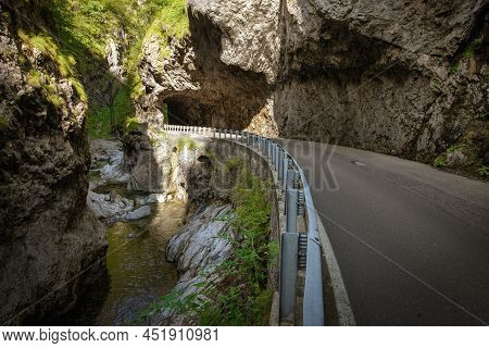 Mountain Road In The Gorge Of The Mountains Near The City In Italy San Pelegrino