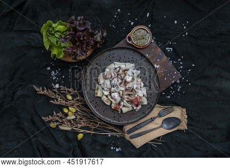 Fresh Grilled Squid, Octopus Tentacles And Squids Eggs On Ceramic Plate Served With Fresh Vegetables