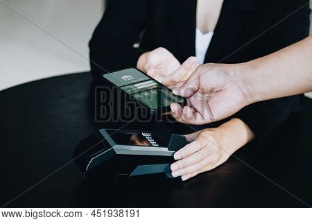 Payment Security Technology Concept And Service Fees, Employees Are Holding Electronic Card Machines