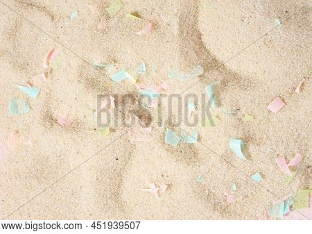 Conceptual Composition Of Microplastics And Coastal Sand. The Impact Of Microplastic On Nature. The