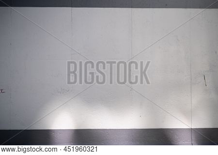 Empty Berlin Wall Graffiti Mockup. Grey Concrete Wall With Sun Light And Shadows. East Side Gallery