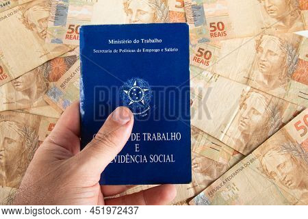 Hand Holding Brazilian Document Work And Social Security (carteira De Trabalho E Previdencia Social)