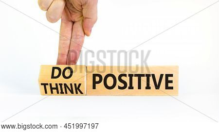 Think And Do Positive Symbol. Businessman Turns Wooden Cubes And Changes Words Think Positive To Do 