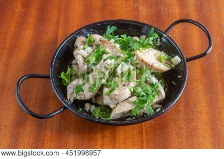 Mediterranean Dish Appetizer Of Boiled Cod Roe Marinated In Olive Oil And Parsley. In A Saucepan On 