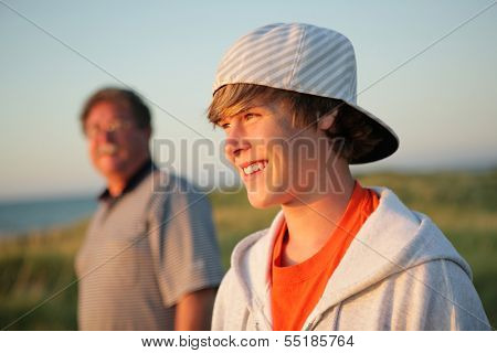 Smiling teen with father