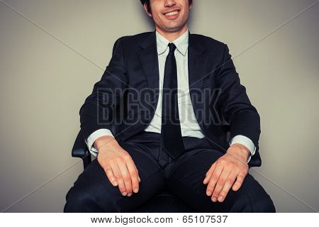 Businessman Sitting In Office Chair