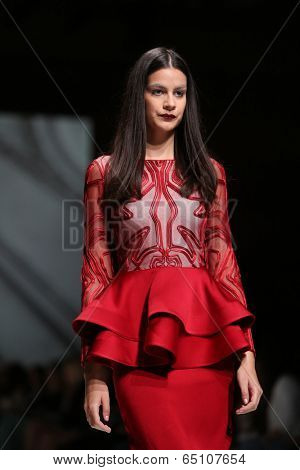 ZAGREB, CROATIA - MAY 09: Fashion model wearing clothes designed by Avaro Figlio on the Zagreb Fashion Week on May 09, 2014 in Zagreb, Croatia.