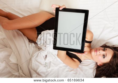 Sexy Lazy Girl Lying With Tablet Touchpad On Bed