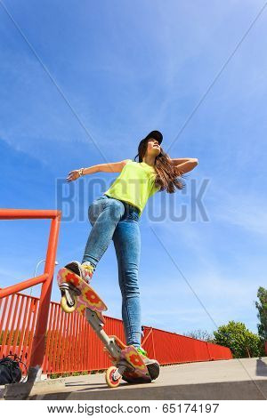 Summer Sport. Cool Girl Skater Riding Skateboard