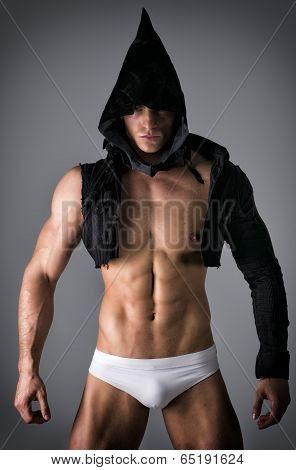 Scary Muscular Young Man With Pointed Hood And Top