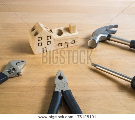 Set of tools and handmade wood house toy.