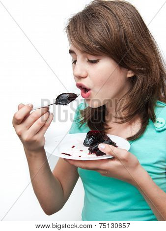 unny teen girl eating charlotte on the white background