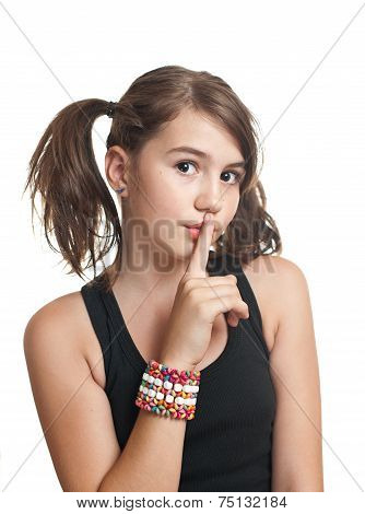 A beautiful teen girl in black top with pigtails. Portrait of smiling girl with two pigtails