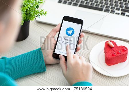 Woman Holding Iphone 6 Space Gray With Service Telegram