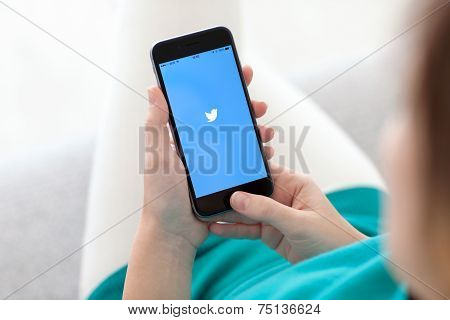 Woman Holding Iphone 6 Space Gray With Service Twitter