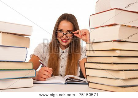 Happy Asian Caucasian Girl Lerning In Study Woth Lots Of Books On The Table