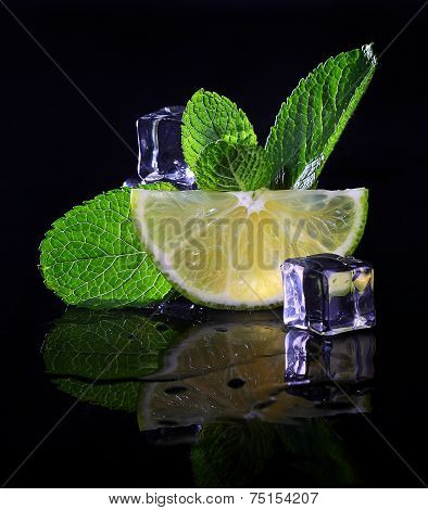 Juicy lemon with fragrant fresh mint and ice cubes