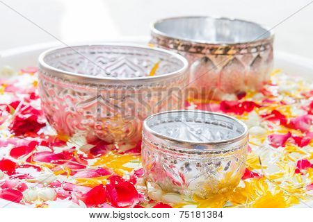 Water In Bowl Mixed With Perfume And Vivid Flowers Corolla For Songkran Festival In Thailand.