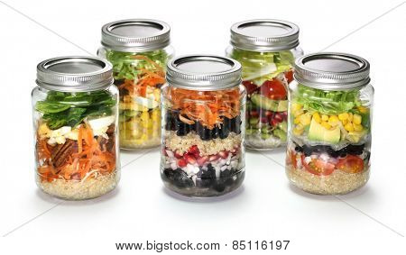 vegetable salad in glass jar on white background 