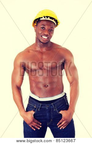Happy handsome african man wearing construction helmet.