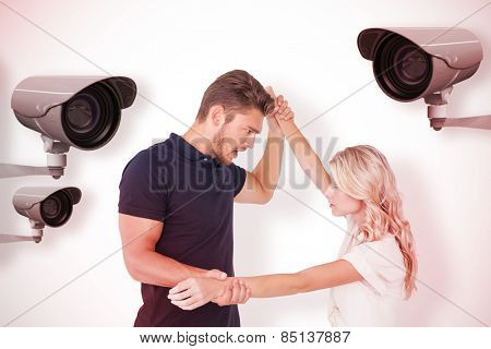 Angry man overpowering his girlfriend against cctv camera
