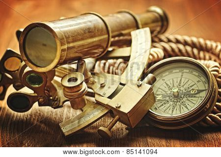 vintage  still life with compass,sextant and spyglass 