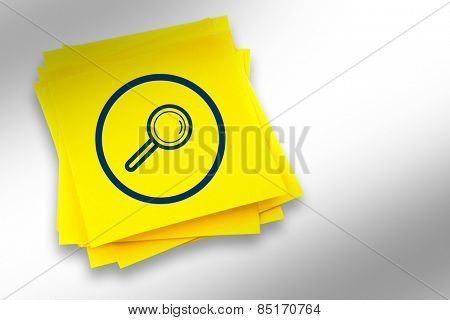 Magnifying glass graphic against sticky note