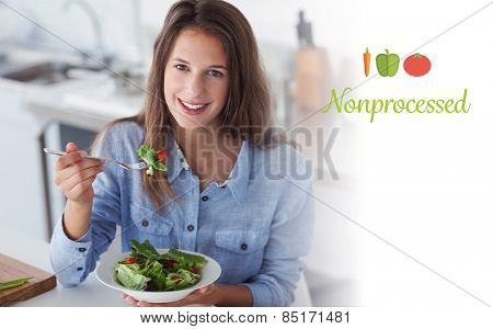 The word nonprocessed against pretty woman eating a salad