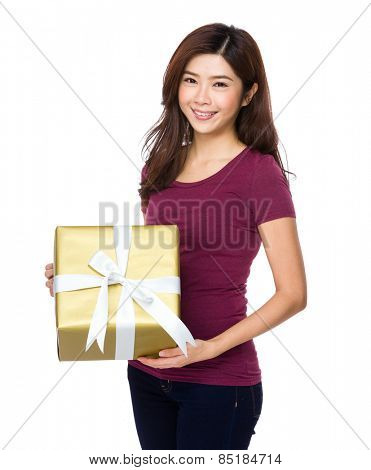 Beautiful girl holding a gift box