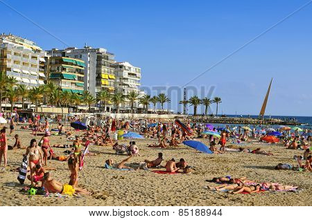 SALOU, SPAIN - AUGUST 24: Vacationers in Llevant Beach on August 24, 2014 in Salou, Spain. Salou is a major destination for sun and beach for European tourism with more than 50,000 accommodations