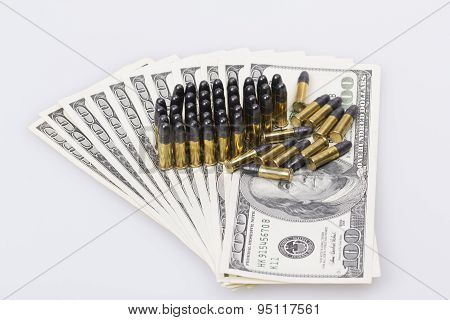 ammunition from the gun on 100 dollar bills