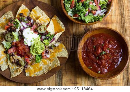 Homemade Nachos with tortilla chips cheese and guacamole,