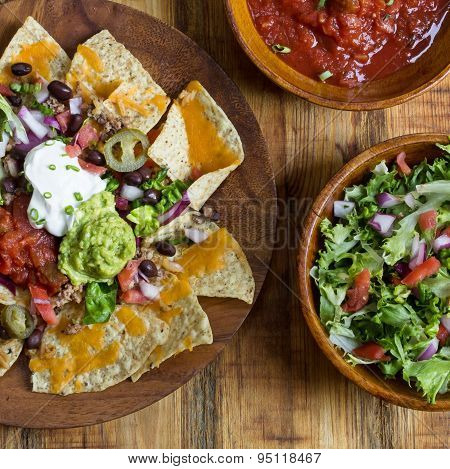 Homemade Nachos with tortilla chips cheese and guacamole,