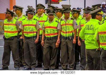 Policeman waiting for Pope Francis Popemobile motorcade comming as his first oficial visit to Quito,