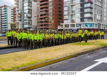 Policemen waiting for Pope Francis Popemobile motorcade coming as his first official visit  to Quito