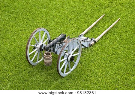 Old cannon on wheels in exhibition