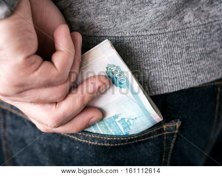 Hand Put Rubles In Jeans Pocket