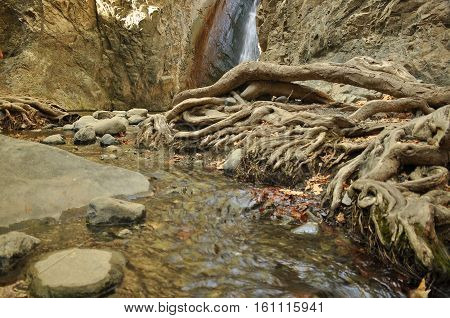 Rainbow at the waterfall Millomeris in the mountains in Cyprus