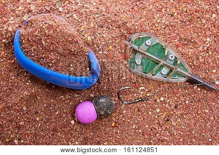 Dry Feed For Carp Fishing As Background. Ready For Use Carp Bait With Fishing Flat Feeder For Carp F